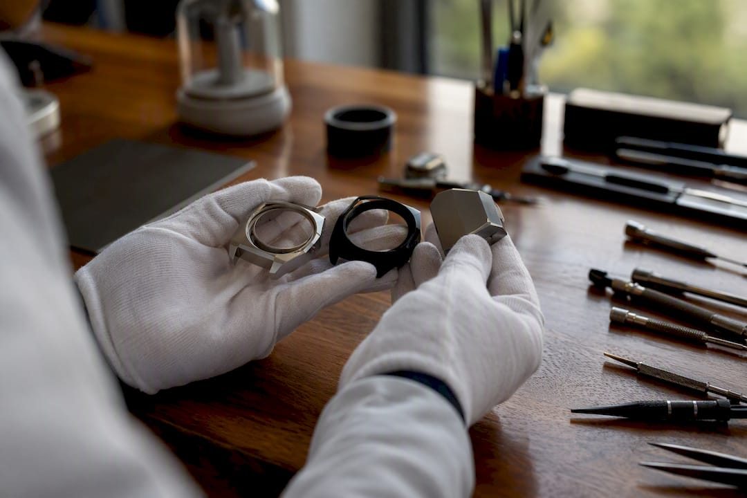 Close-up of three different watch case metal samples