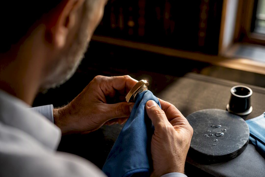Careful polishing of a gold watch case