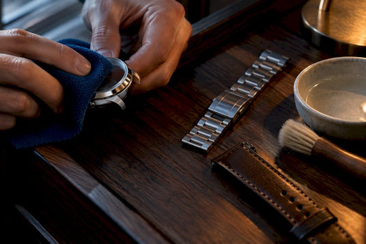 Anonymous watch parts being cleaned by material