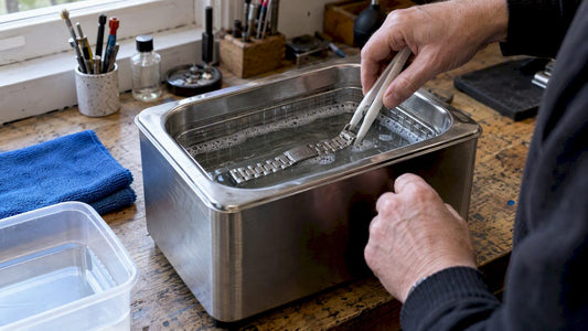 Watch bracelet submerged in ultrasonic cleaner